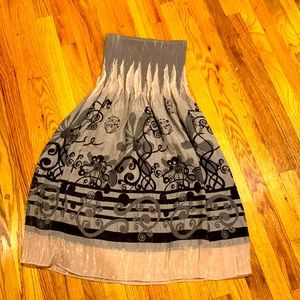 Strapless dress with snug (elastic) fit on top. Iridescent taupe with black.